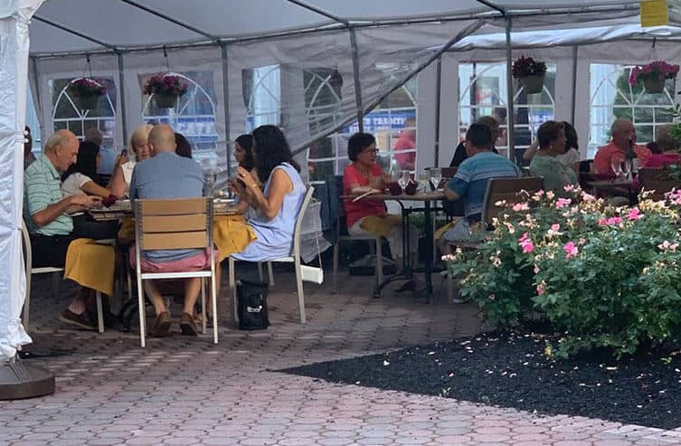 Guests dining at Ciao Bello patio